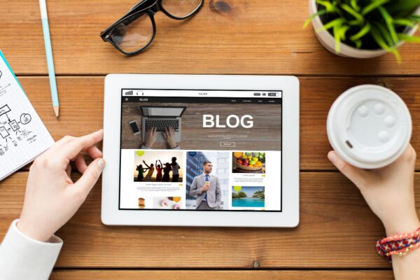business technology media internet people concept close up woman with blog web page tablet pc computer screen coffee wooden table